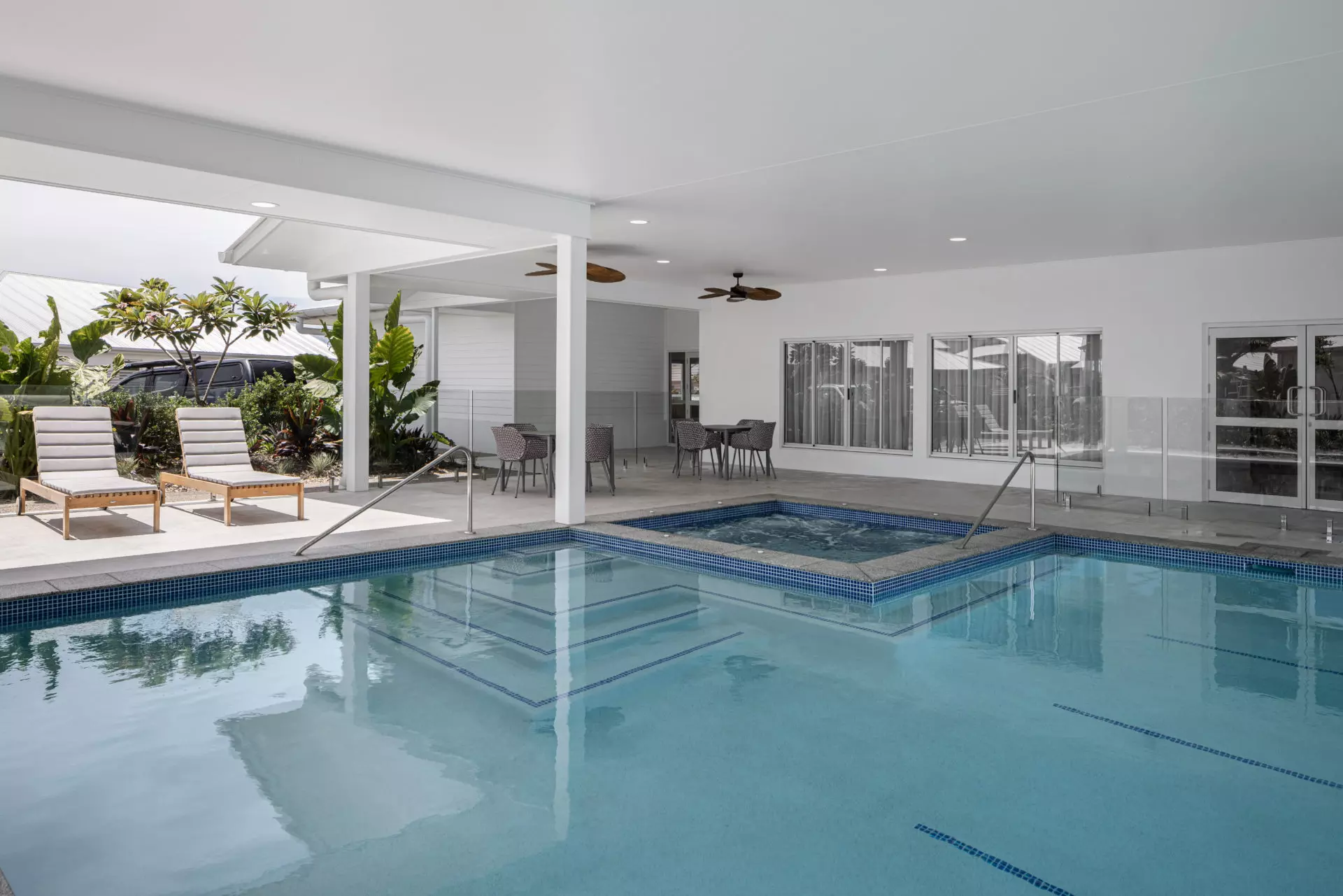 Covered pool area glazing at Palm Lake Resort Bargara.