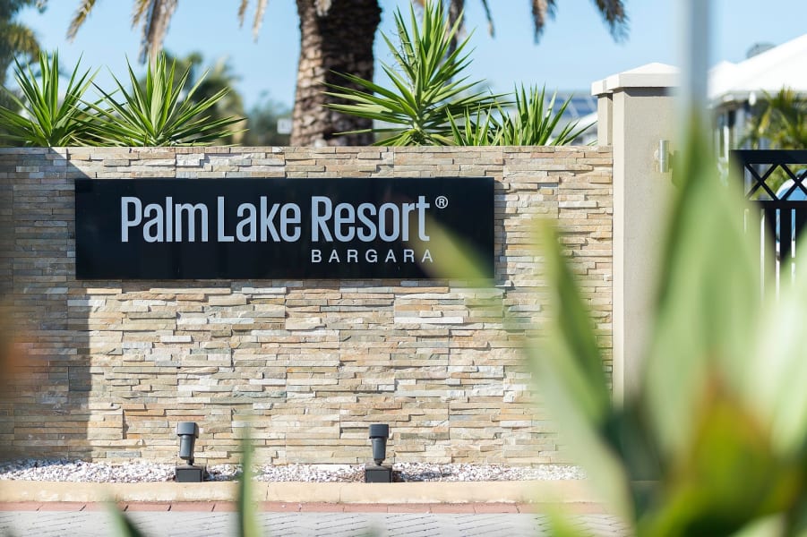 Palm Lake Resort Bargara entry sign.