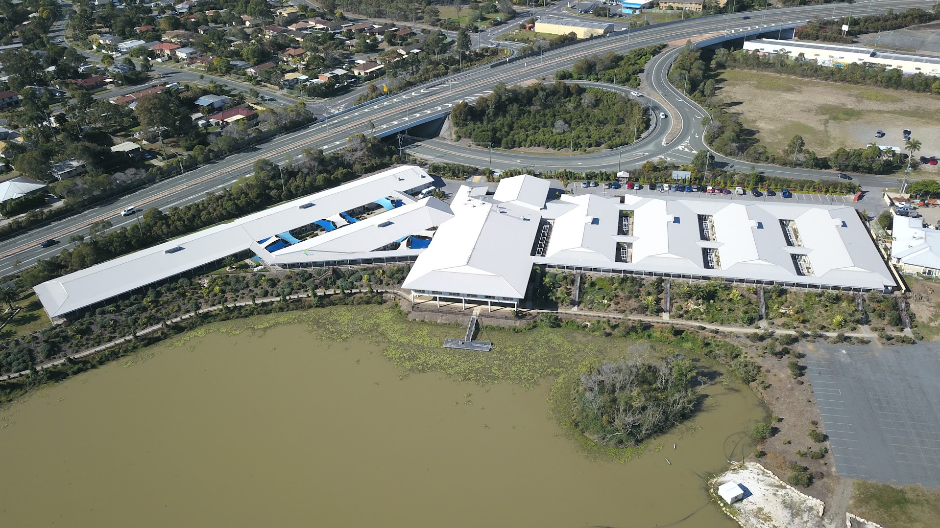 Aerial view of Palm Lake Resort Bethania and its community facility glazing.