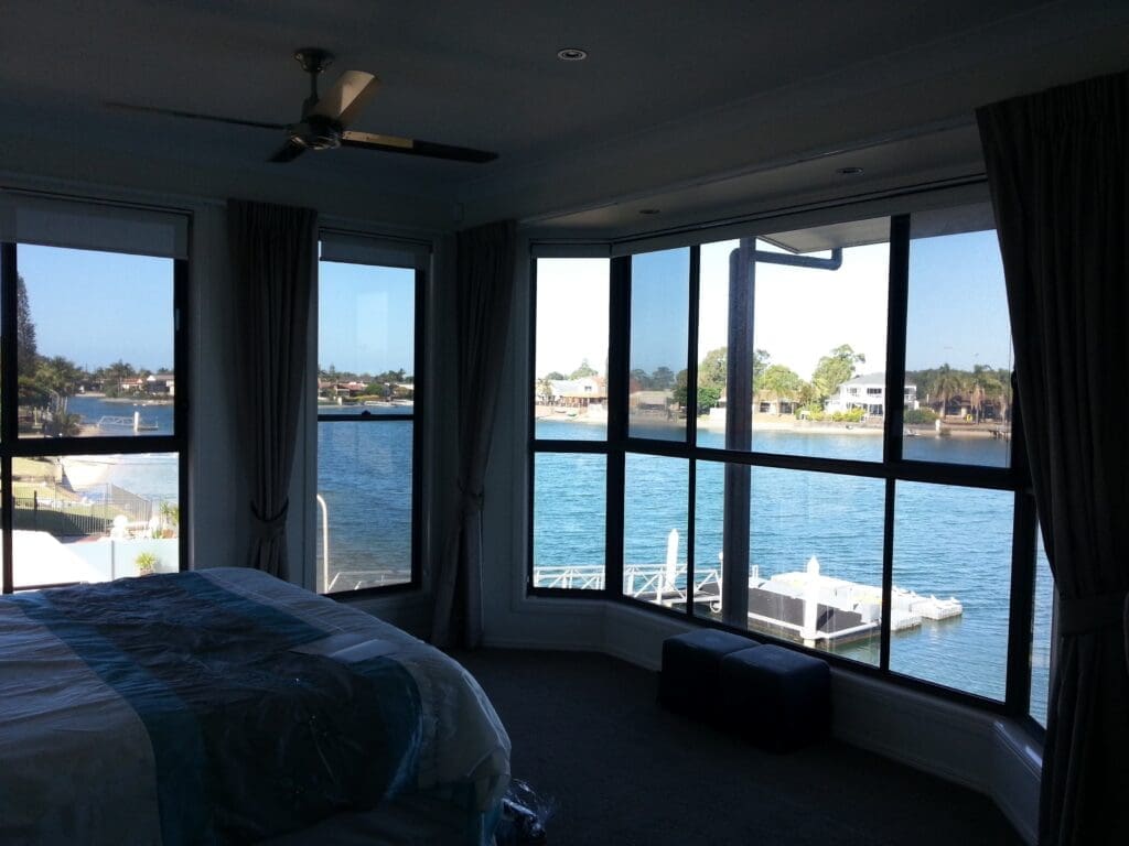 Residential lounge windows with installed film reducing glare.