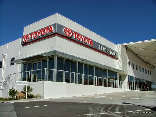 Commercial glazing reducing glare and sun load on a business exterior.
